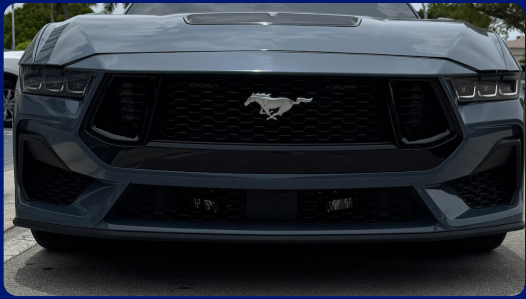 InsightLPR marketing image showing a covert mobile license plate reader camera mounted on a vehicle.